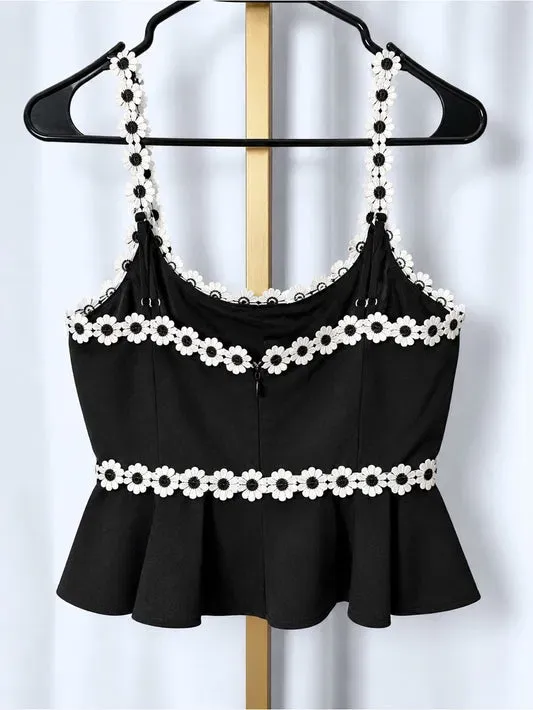 Black camisole with white floral trim